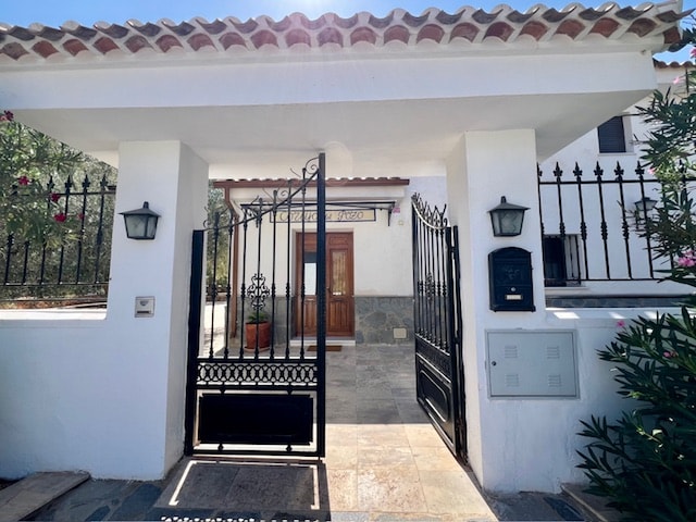 Gated main entrance to the property