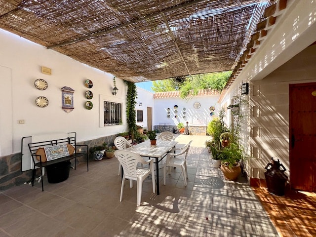 Shaded Andalusian courtyard with outdoor dining